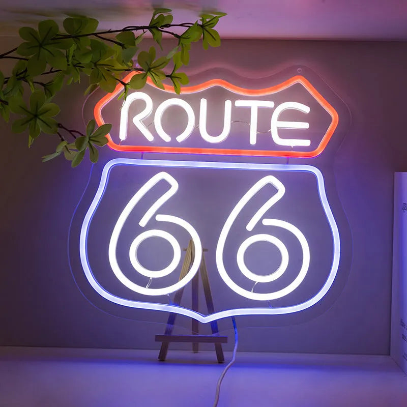 66 Highway LED neon word sign emitting warm white glow against a dark background