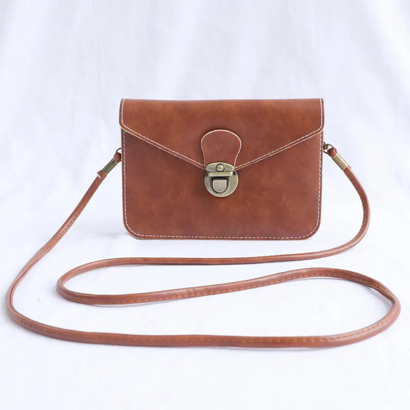 Retro soft surface messenger bag with crossbody strap and secure lock closure