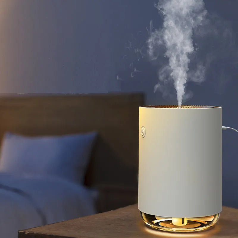 Green USB night light humidifier and essential oil diffuser with colour changing LED on a table