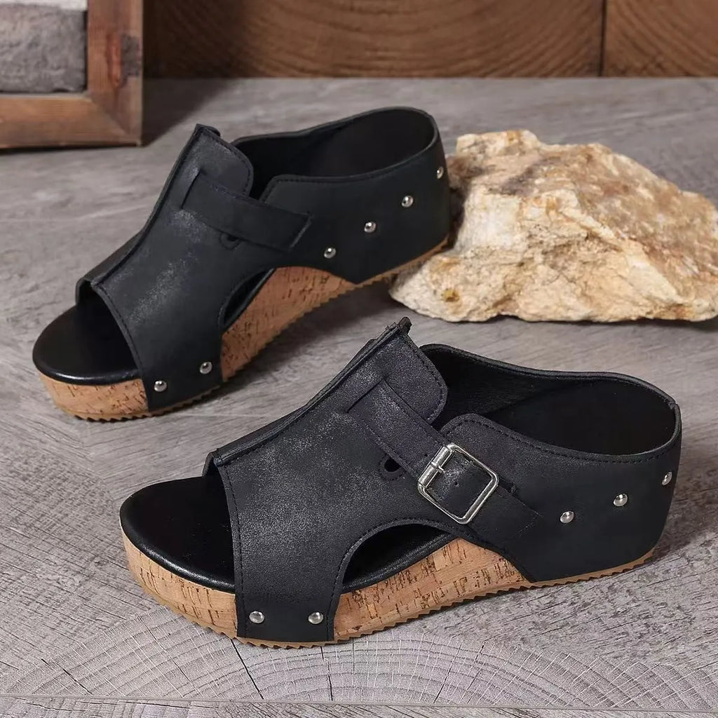Plus size wedge sandals with rivet detailing, fish mouth open toe, PU upper, and rubber sole in black colour option.