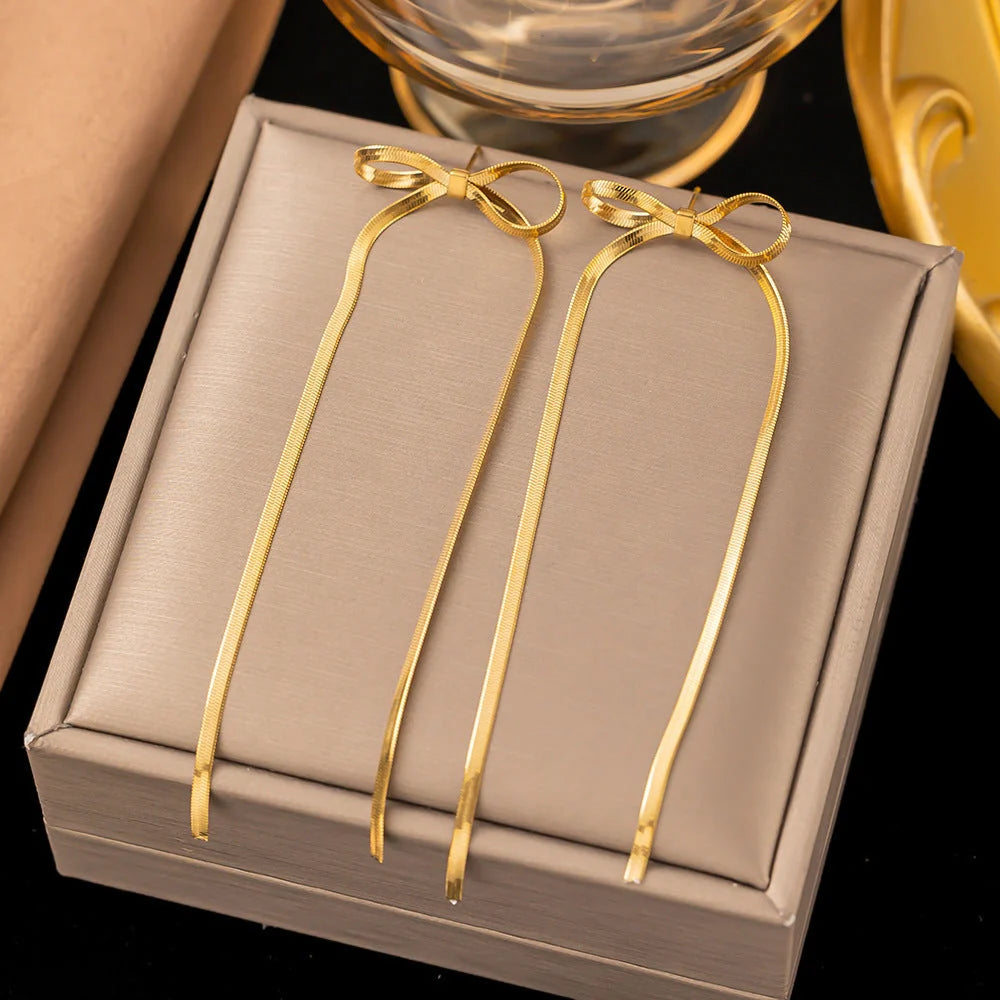 Hypoallergenic 18k gold plated herringbone bow earrings with tassel tails