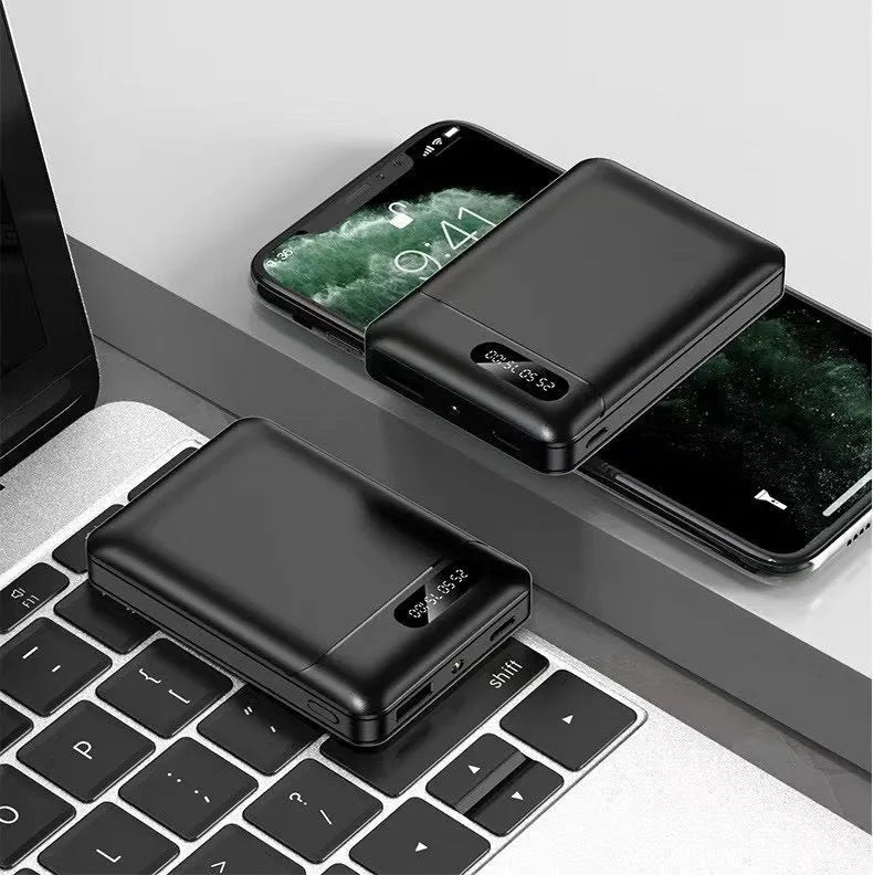 White and black portable power bank with multiple USB ports showing 10000mAh capacity label