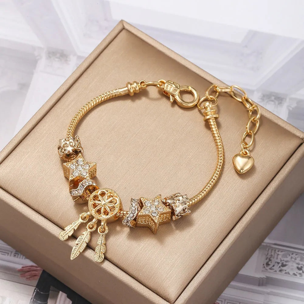 Unisex alloy bracelet with dreamcatcher pendant and star bead, KC gold finish, lobster clasp