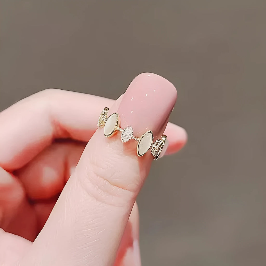 Copper geometric water drop ring for women with electroplated finish on white background