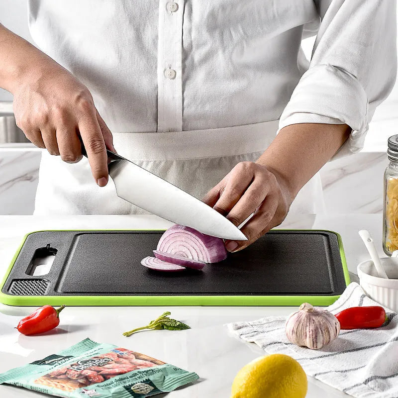Grey square aluminium cutting board with grinding teeth and integrated knife sharpener