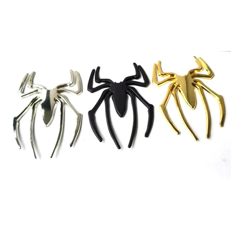 Three-dimensional metal spider bumper sticker in metallic finish.