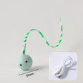 Green electric wagging tail cat ball toy on floor with motion sensor for interactive play
