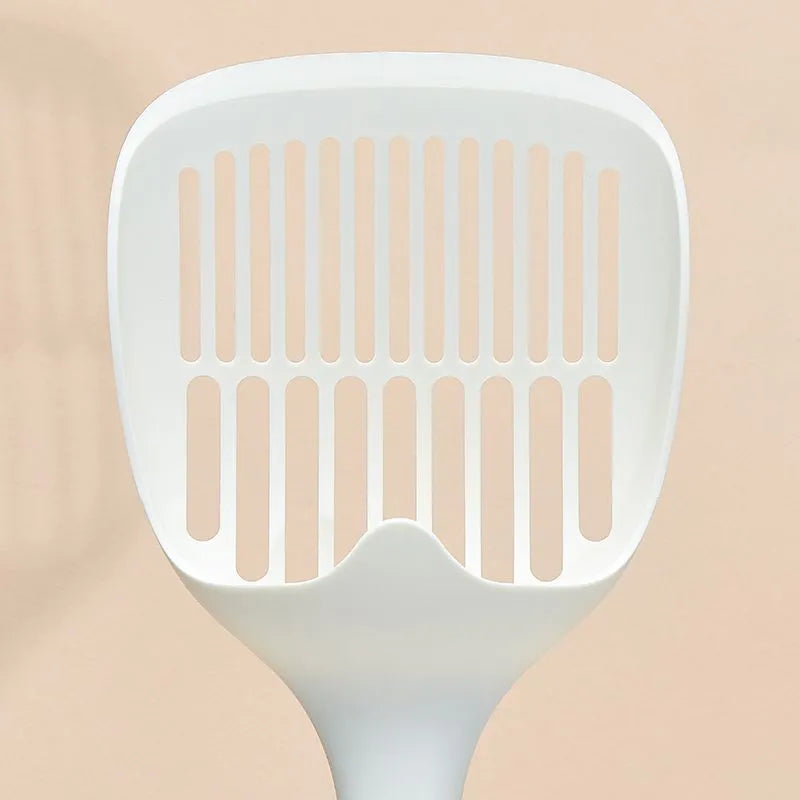White plastic cat litter scoop with storage base for litter tray cleaning