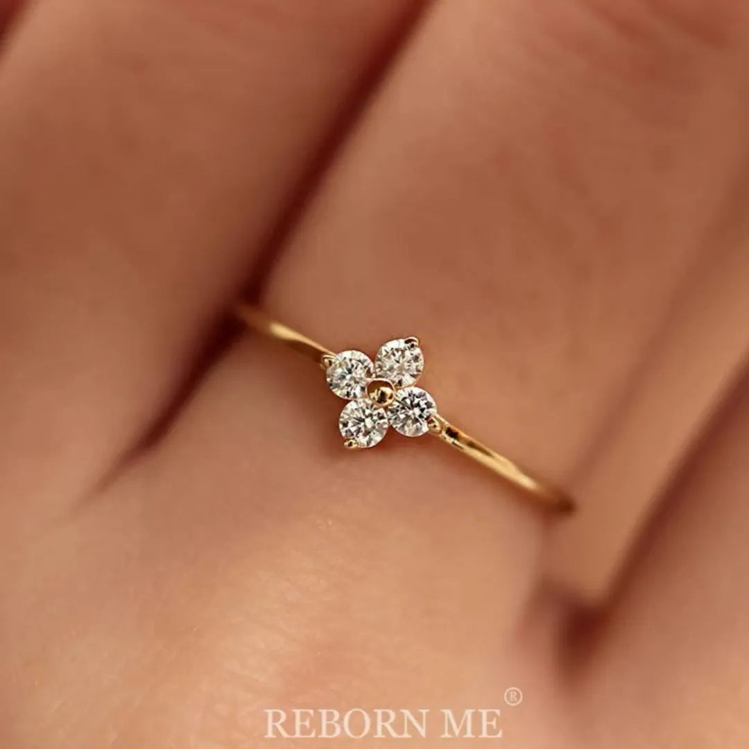 Champagne copper adjustable ring with four-leaf clover and rhinestone flower detail