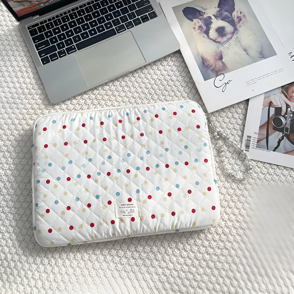 Women's polka dot polyester laptop bag shown in a solid colour, suitable for a 15.6 inch device.