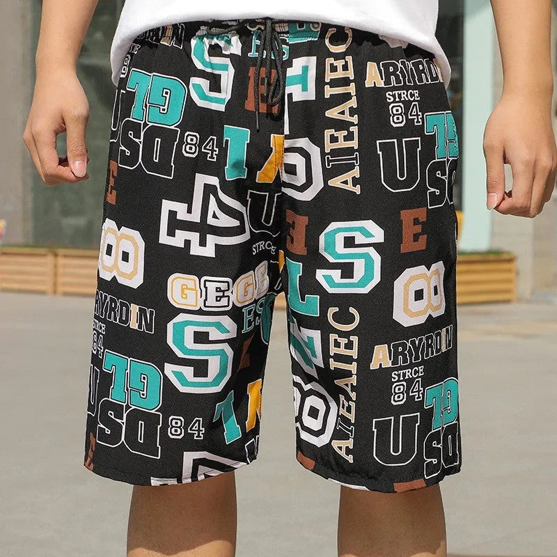 Man's loose-fitting striped beach pants made from quick-drying polyester fabric.