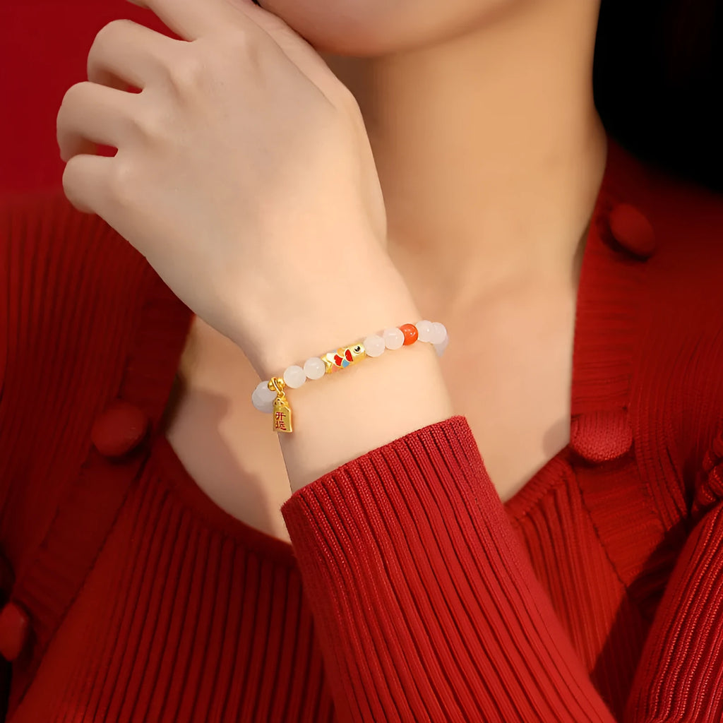 S925 sterling silver bracelet with a cold enamel crafted koi and natural Hetian jade element.