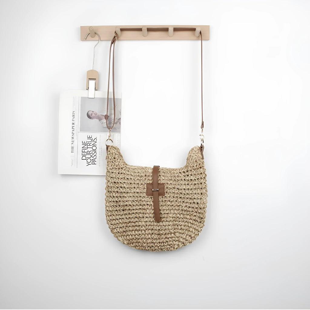 Beige handmade woven bag with a special-interest design and a long shoulder strap.