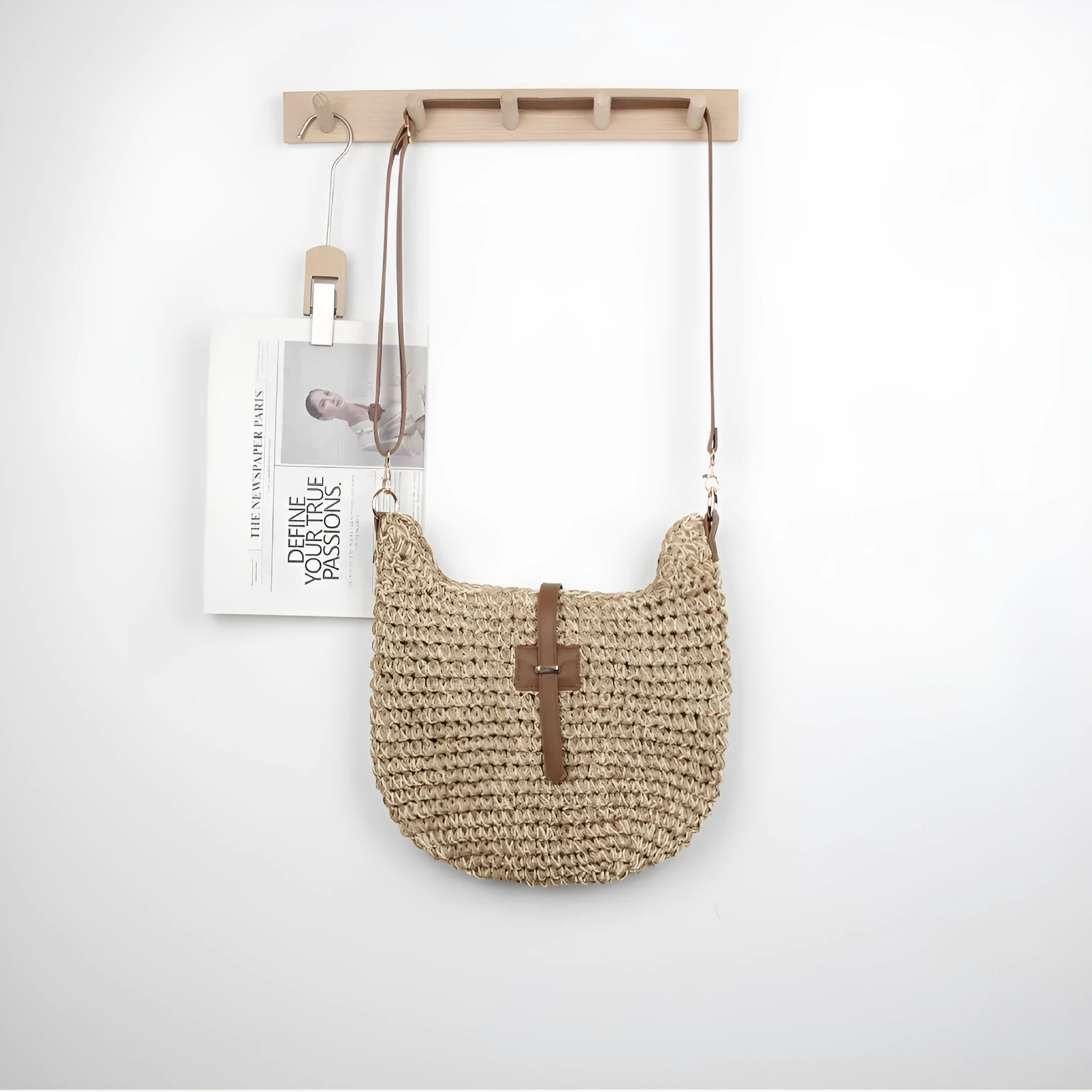 Beige handmade woven bag with a special-interest design and a long shoulder strap.