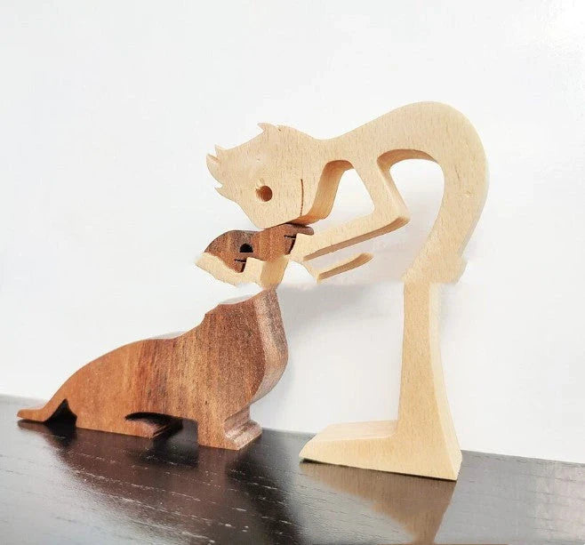 Handcrafted wooden dog sculpture featuring a man and his loyal canine companion