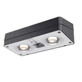 Black solar LED fence light with colourful fixed lens, IP55 rated, 105mm, mounted on a wooden fence