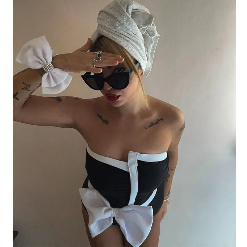Women's black and white colour-block one-piece swimsuit with asymmetric bow and irregular tube top