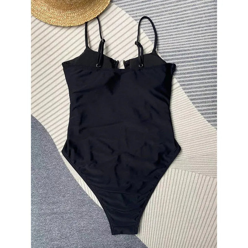 Women's black solid colour one-piece swimsuit with bikini style and tight fit
