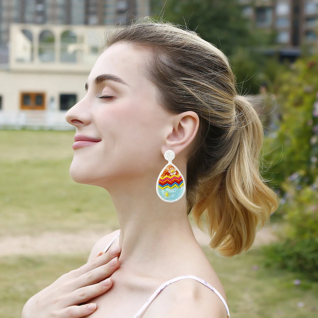 Hand-woven beaded drop earrings in geometric Easter egg shape, colour E69066, 6.7cm by 3.7cm