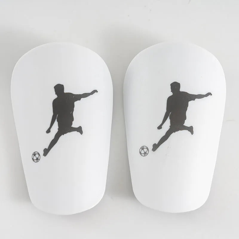Mini football leg protector in black PU material, size XS, measuring 8 cm by 5 cm