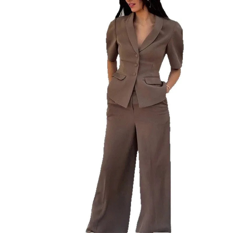 Brown men's slim fit polyester suit set comprising a long-sleeve top and matching trousers on a hanger.