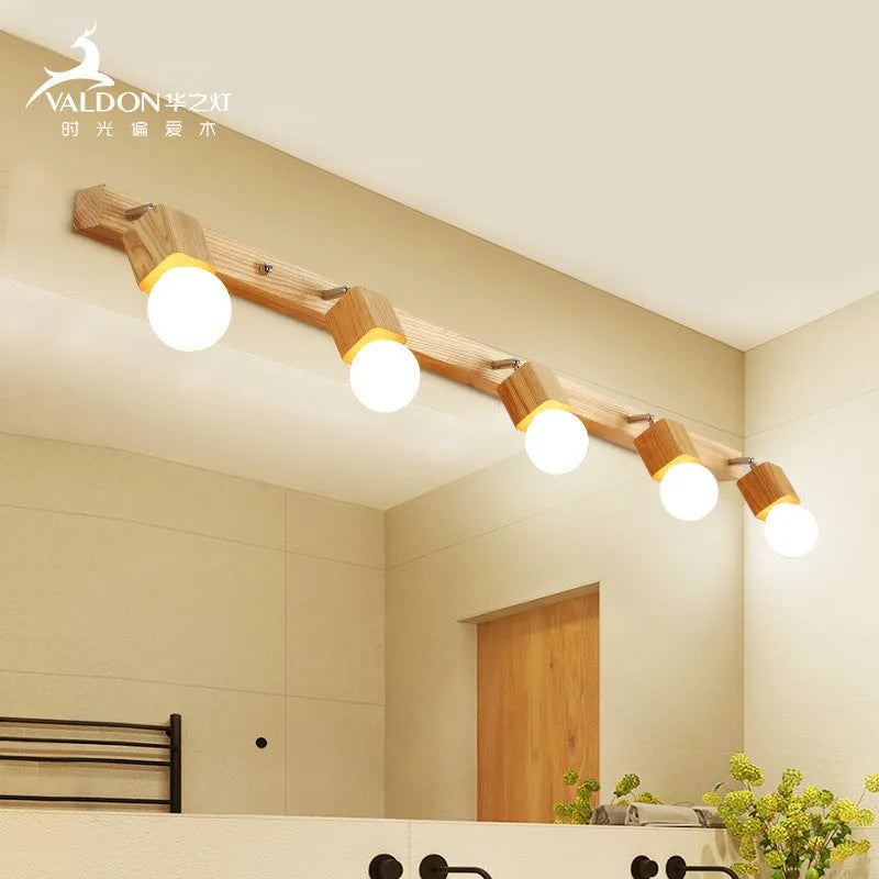 A narrow 24cm wide mirror-finish LED wall lamp with a single light head.