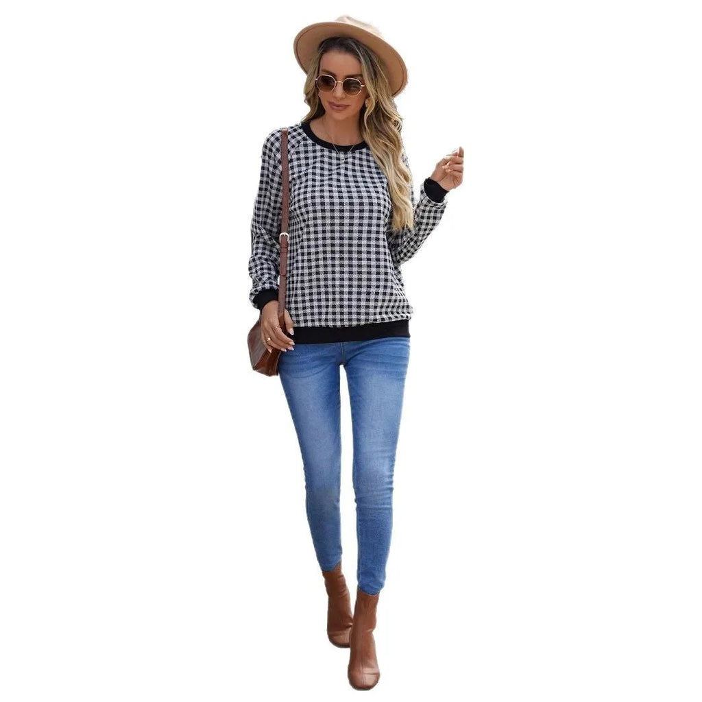 Black long sleeve pullover sweater with a printed plaid stripe pattern on a mannequin.
