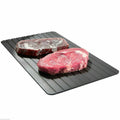 Black aluminium fast defrost tray for thawing frozen meat and food quickly without electricity.