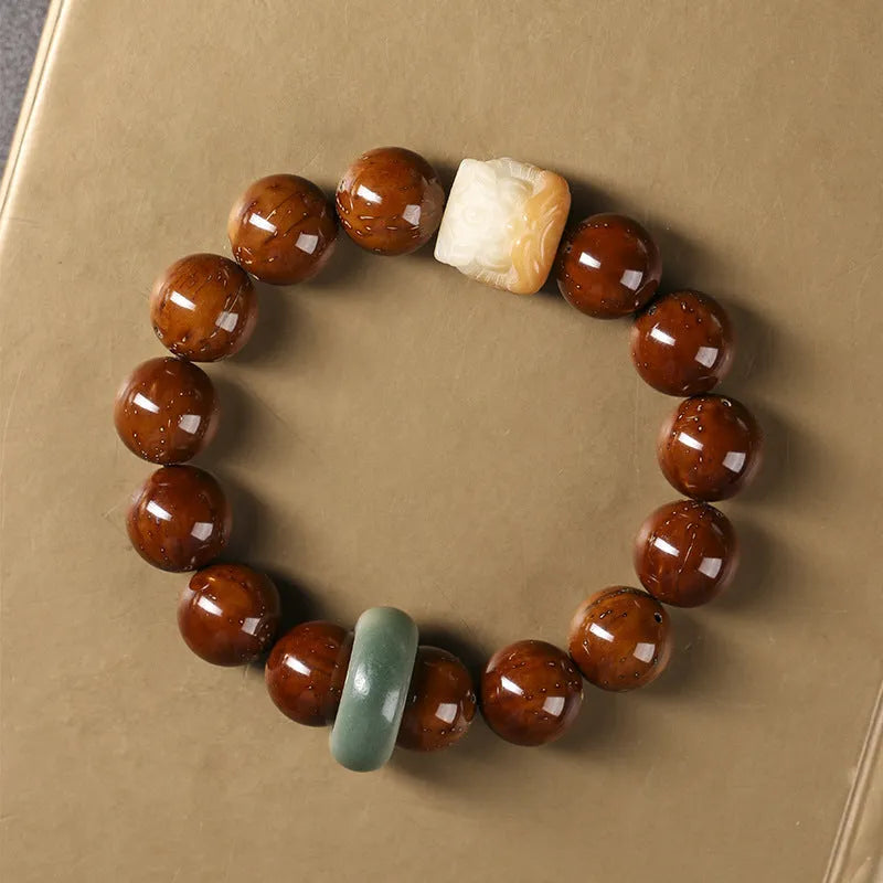Ivory nut lion style round bead bracelet with 13mm natural seed beads in hand-woven construction