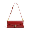 Women's cowhide leather cross-body bag in pillow shape with clamshell opening, shown in milky white colour