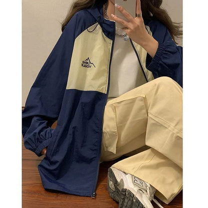 Women's summer sun protection top with raglan sleeves in apricot colour showing loose fit and splicing details