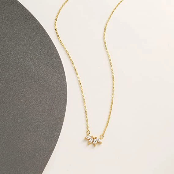 Minimalist lotus flower petal necklace in gold and silver, perfect for parties and everyday wear