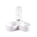 White cat water fountain with flower-shaped top and LED light on a kitchen counter