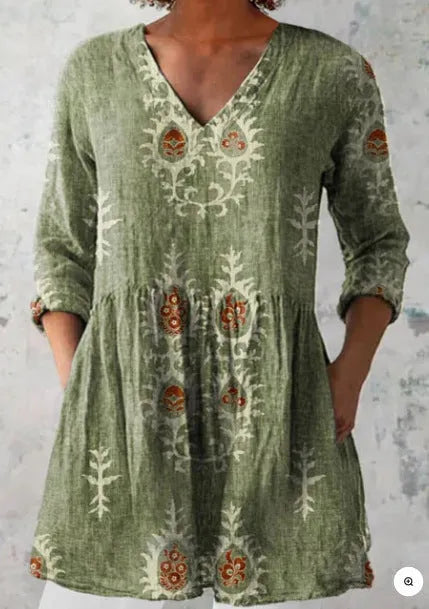 Women's printed loose-fit maxi dress with wide waist and three-quarter length sleeves.