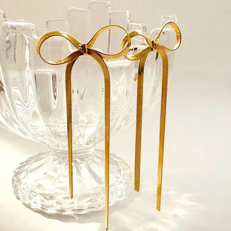 Hypoallergenic 18k gold plated herringbone bow earrings with tassel tails