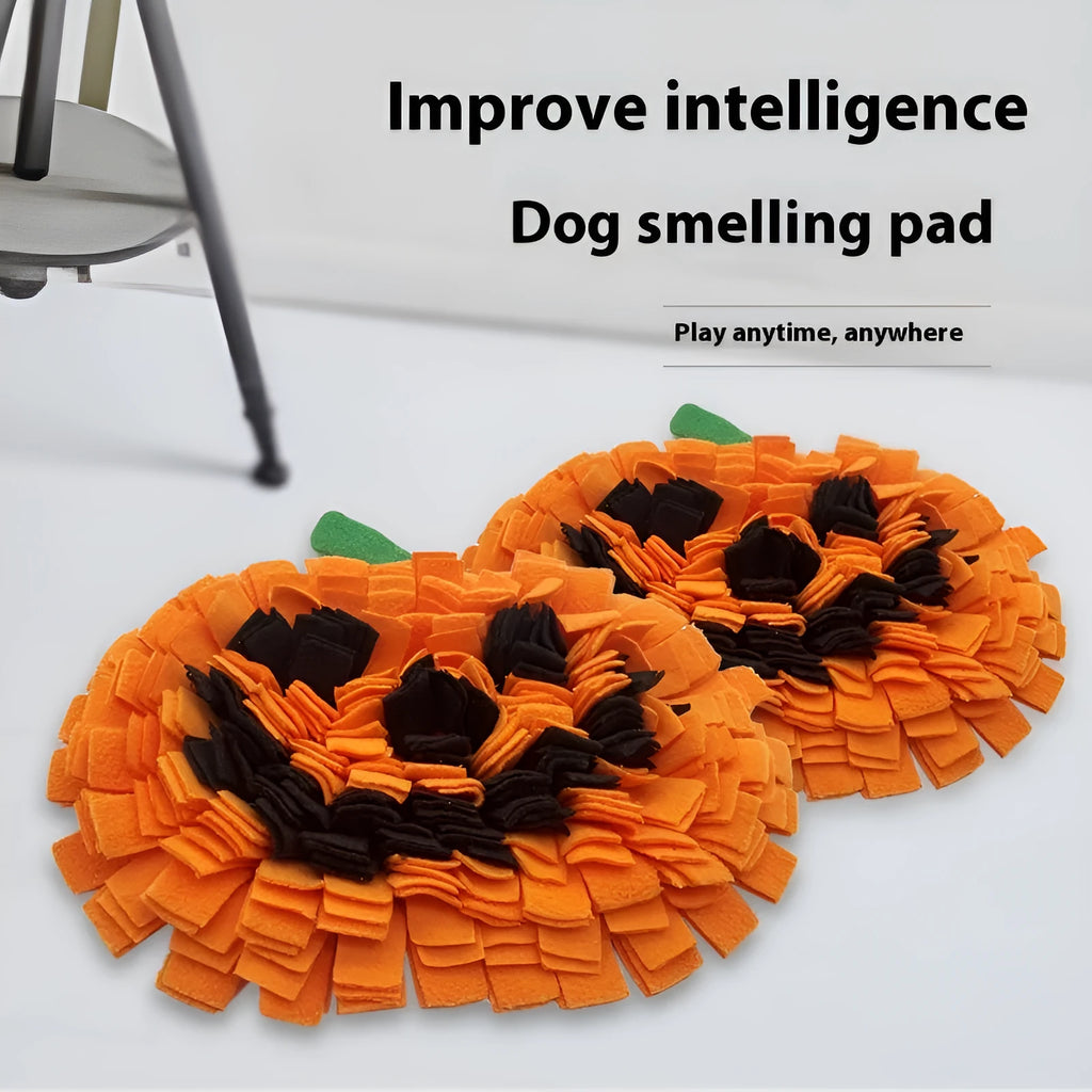 Orange pumpkin-shaped dog slow feeder mat with fleece texture on wooden floor