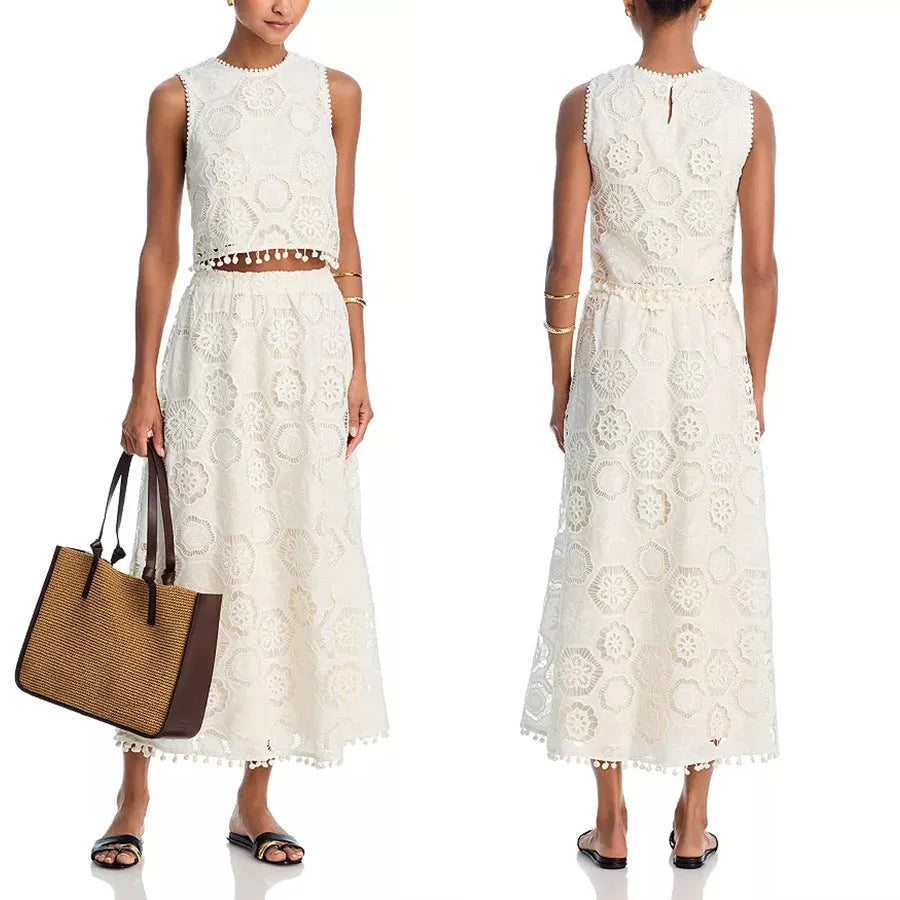 White women's sleeveless top and long skirt suit set with retro embroidery details.