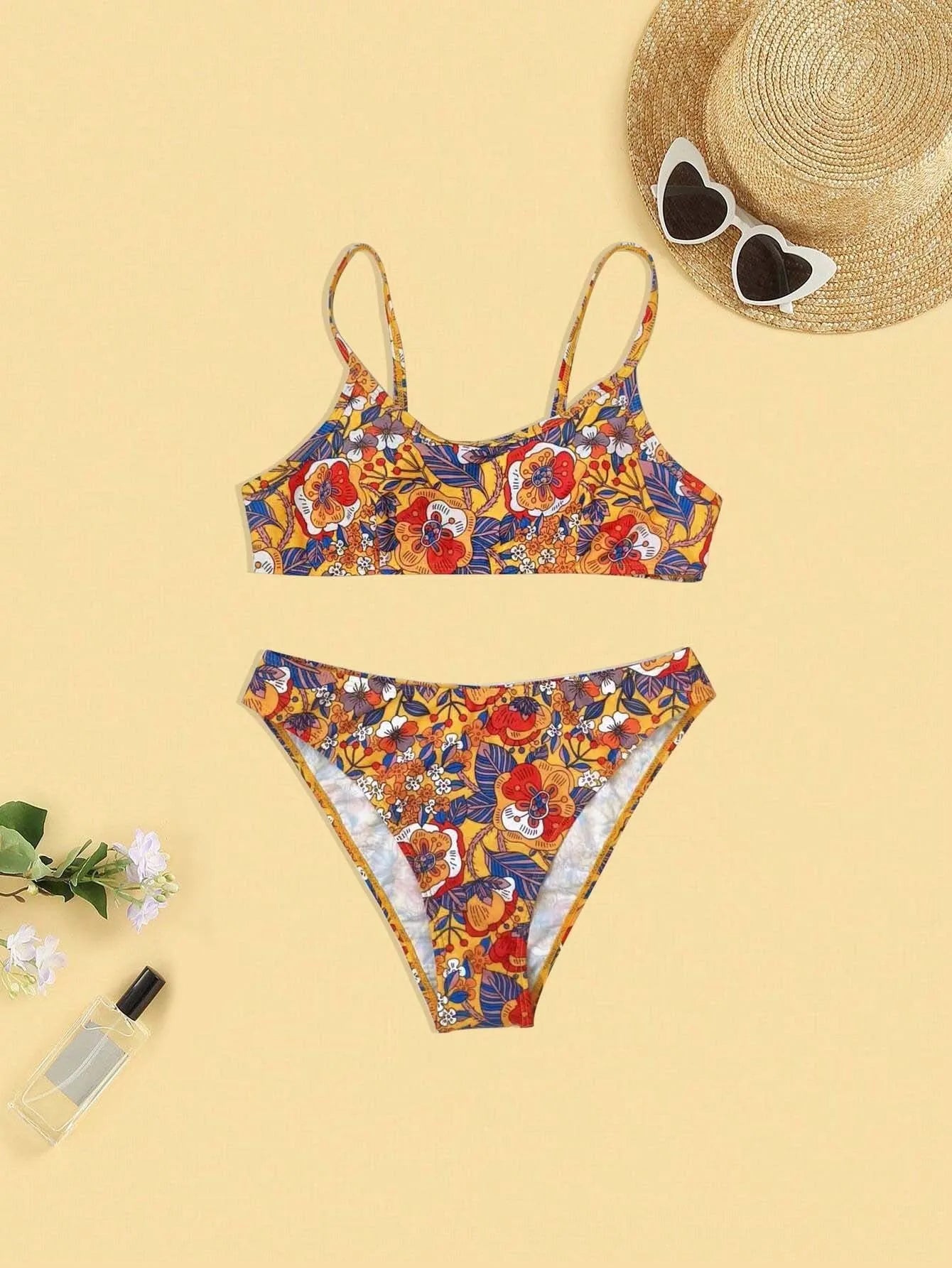 Plus size women's floral print bikini swimsuit with strap design on white background