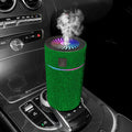 Compact white diamond car air humidifier on a car dashboard with USB cable.