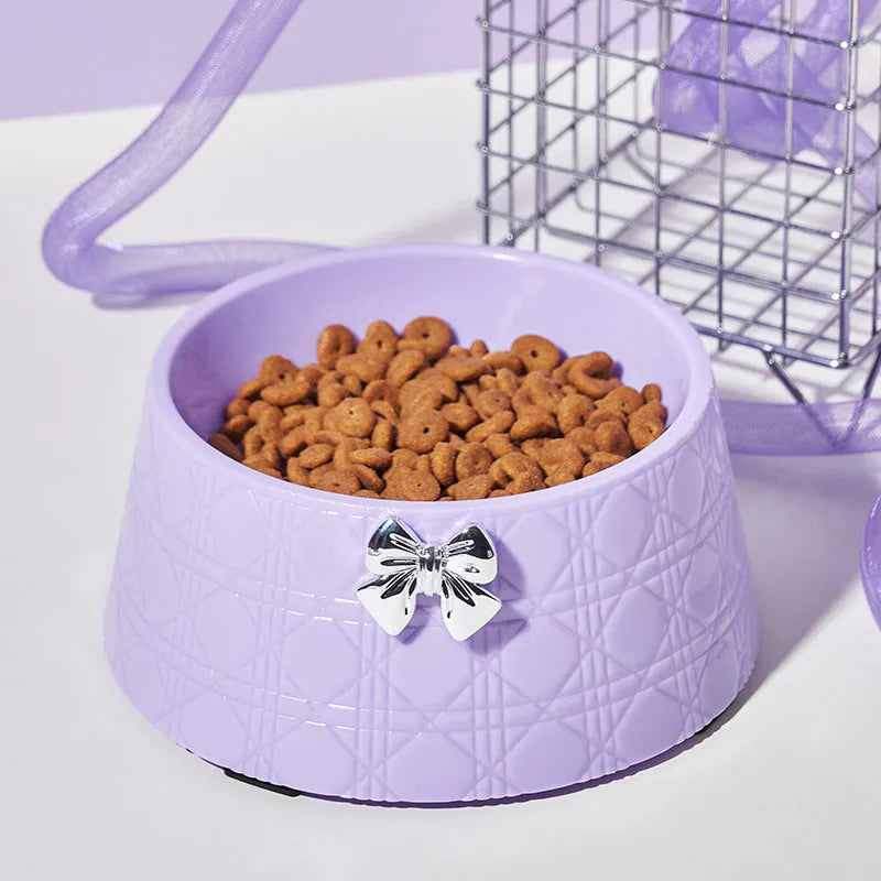 Ceramic pet bowl with bowknot and diamond pattern in pink, silver, black, purple, or white.
