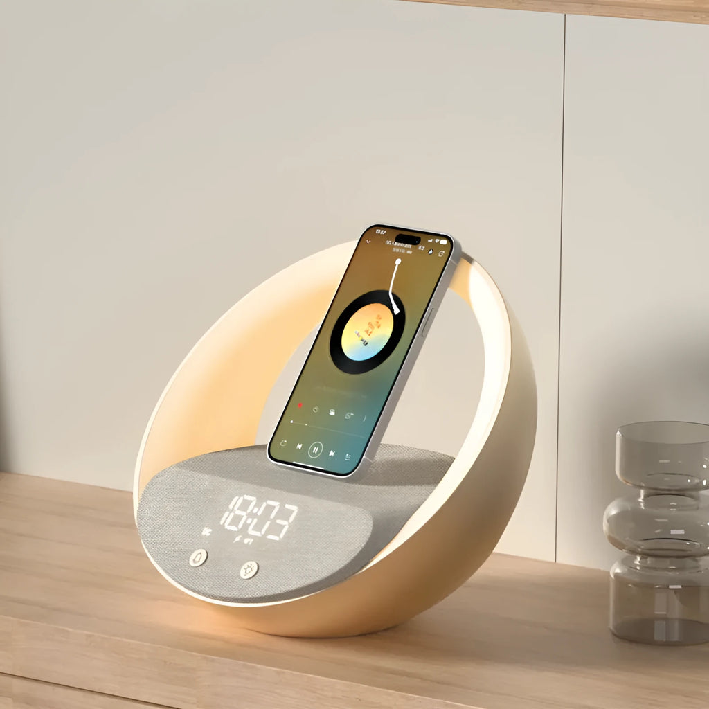 Beige or grey multifunctional desk unit with wireless charging pad, speaker grille, digital clock display, and LED light panel