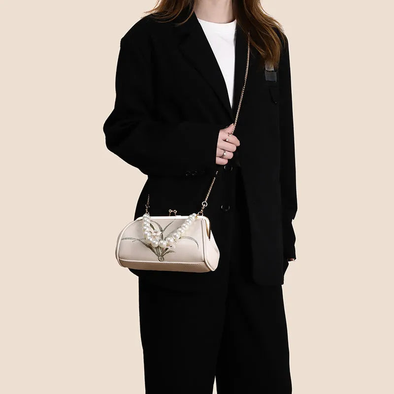 Beige soft PU leather women's shoulder bag with embroidery detail and shell shape design