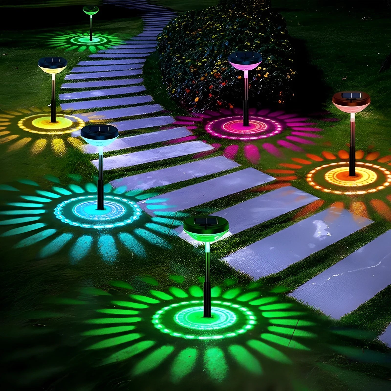 Outdoor solar lawn projection water droplet lights with RGB colour gradient and warm light modes, inserted in grass