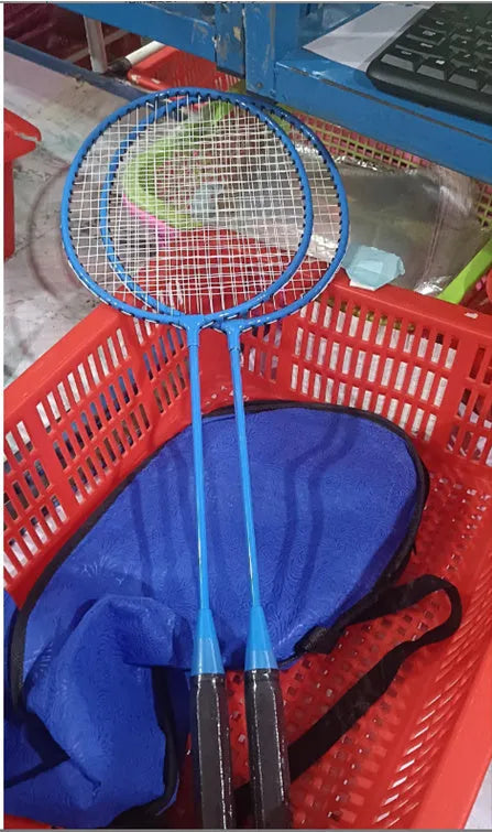 A pair of blue and red alloy ultra-light split badminton rackets laid side by side.