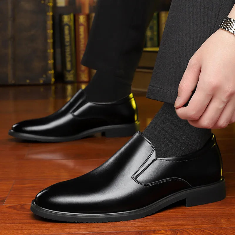 Men's black slip-on business casual loafers with leather toe cap and rubber sole