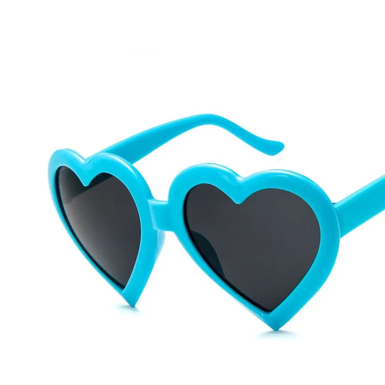 Children's heart-shaped sunglasses with bright red resin lenses and full rim frame