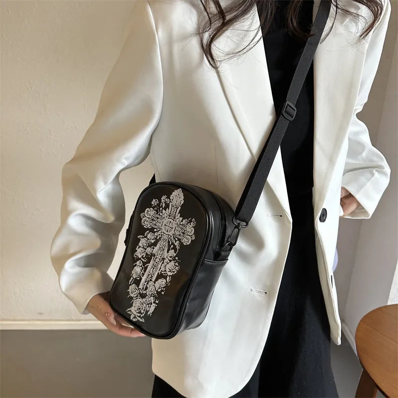 Halloween-themed crossbody phone bag with cartoon pumpkin, ghost, and bat print.
