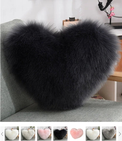 Plush heart-shaped throw pillows in various colors and styles for cozy sofa decor