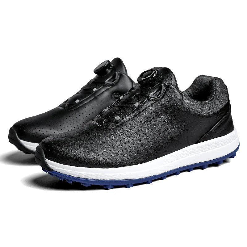 Men's low-top white golf sneakers with breathable hollow-out sole on grass.