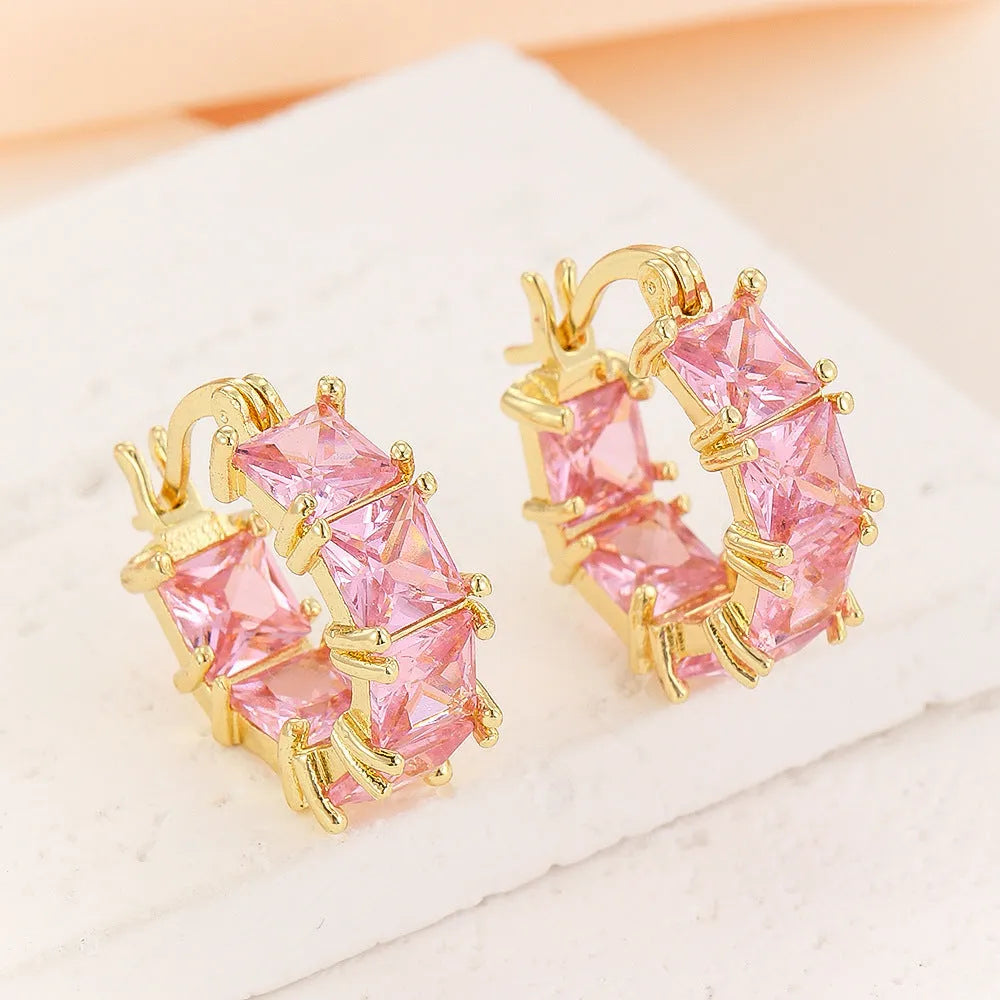 Geometric U-shaped gold electroplated earrings with round black zirconium stones